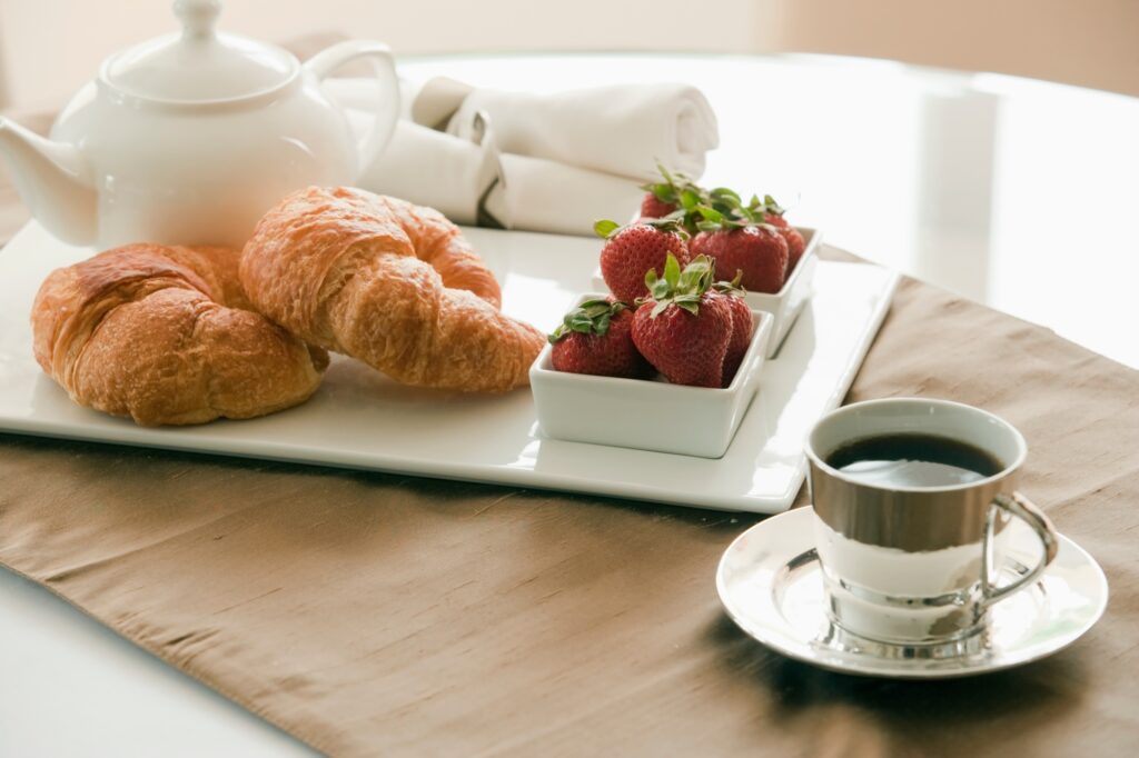 Breakfast Setting on Table, croissants and jam
